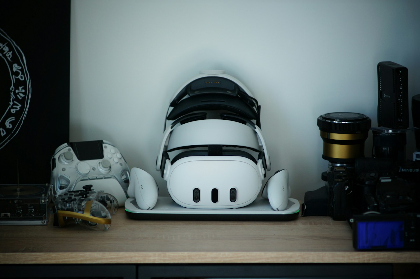 Virtual reality headset and controllers arranged on a display shelf.